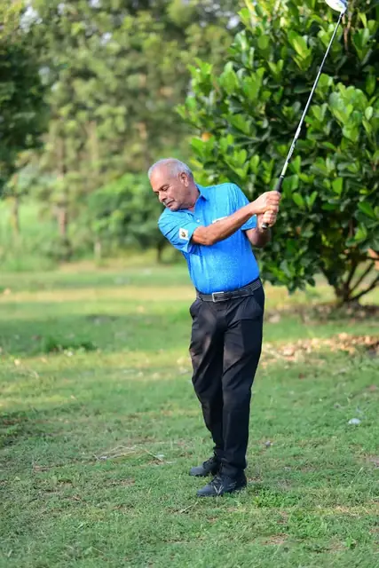 Tigers player finishing a full swing